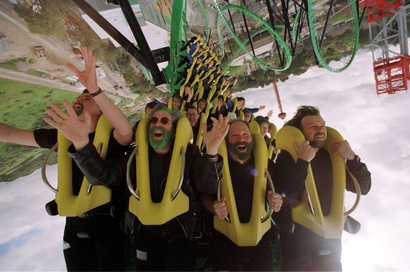 A group of people ride the "Riddler's Revenge" roller coaster at Magic Mountain amusement park in Va.