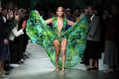 Jennifer Lopez walks the Versace show in the famous plunging green dress. 