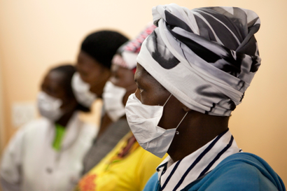 Patients with HIV and tuberculosis (TB) wear masks while awaiting consultation at a clinic in Cape Town's Khayelitsha township