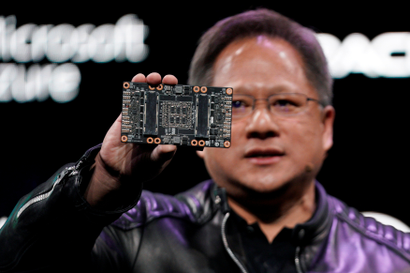 Jensen Huang, CEO of Nvidia, shows the NVIDIA Volta GPU computing platform at his keynote address at CES in Las Vegas, Nevada, U.S. January 7, 2018. 