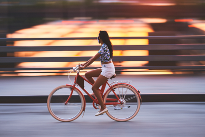 A woman rides a Vela e-bike.