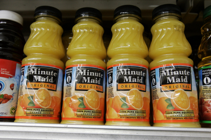 Minute Maid orange juice drinks are on display at JJ&amp;F Market in in Palo Alto, Calif., Monday, Feb. 9, 2009. Minute Maid parent company is Coca-Cola Company. The Coca-Cola Co. said Thursday its fourth-quarter profit fell 18 percent as it dealt with the global recession and volatility in the currency markets. (AP Photo/Paul Sakuma)