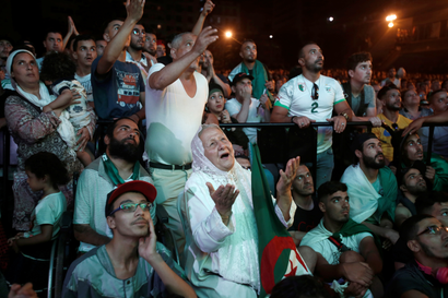 Fans of all ages watching one of Algeria's matches at AFCON 2019 at an Algiers viewing center.