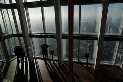 People look out window from London's tallest building