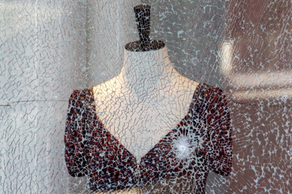 Broken glass from the blast is pictured near the site of a deadly blast in central Bangkok, Thailand, August 18, 2015. A bomb blast at a popular shrine in Bangkok that killed 22 people including eight foreigners did not match the tactics used by separatist rebels in southern Thailand, the country's army chief said on Tuesday.