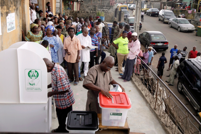 A man casts his ballot as Nigerians vote for a second day in Lagos
