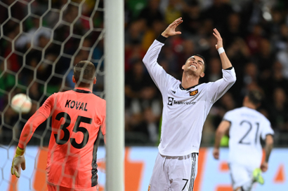 Manchester United's Portuguese striker Cristiano Ronaldo reacts after missing a goal.