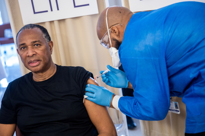 Rev. Jacques DeGraff receives a dose of the Pfizer-BioNTech vaccine against the coronavirus disease (COVID-19), at NYC Health + Hospitals Harlem Hospital in the Manhattan borough of New York City, New York, U.S., February 25, 2021.