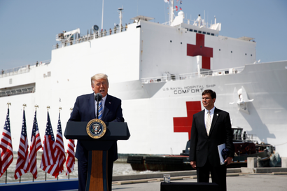 President Donald Trump speaks in front of the U.S. Navy hospital ship USNS Comfort, which is departing for New York to assist hospitals responding to the coronavirus outbreak.