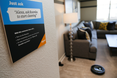 Prompts on how to use Amazon's Alexa personal assistant are seen as a wifi-equipped Roomba begins cleaning a room in an Amazon experience center in Vallejo, California, U.S., May 8, 2018.