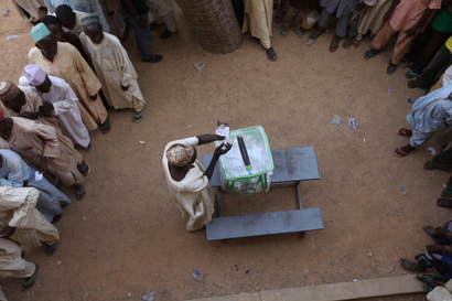 A man casts his vote during the presidential elections in Mashi, Nigeria