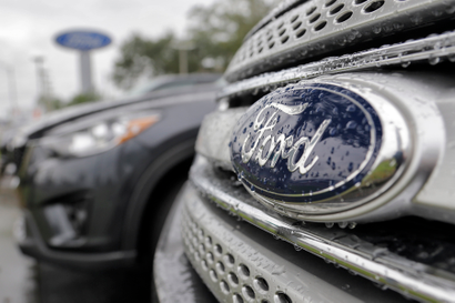 FILE - In this Jan. 12, 2015, file photo, Ford vehicles sit on the lot at a car dealership, in Brandon, Fla. Ford Motor Co. expects its pretax profit to fall in 2017 but improve in 2018 as it invests in emerging businesses. Ford updated its outlook Wednesday, Sept. 14, 2016, at its annual investor day. (AP Photo/Chris O'Meara, File)