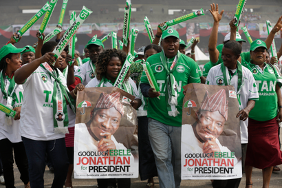 Supporters of Nigeria's president Goodluck Jonathan, dance during an election campaign rally, at Tafawa Balewa Square in Lagos, Nigeria, Thursday, Jan. 8, 2015.
