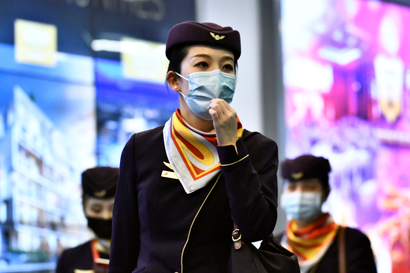 Flight crew wearing face masks.