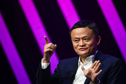 Jack Ma gestures with his hands while talking, presumably at an event.