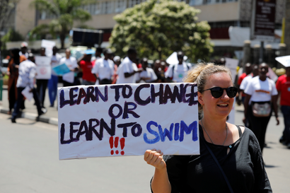 An environmental activist holds a sign as she takes part in the Climate strike protest calling for action on climate change, in Nairobi, Kenya, September 20, 2019.
