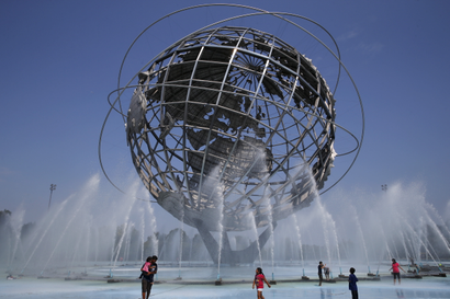 People cool off in the water at the Unisphere at Flushing Meadows Corona Park in the Queens borough of New York in 2015.