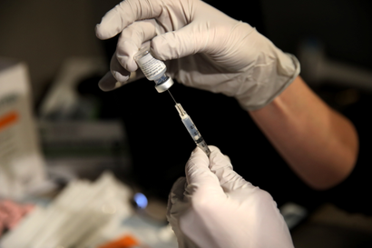 Pharmacy manager Larren Suh prepares a dose of the Pfizer-BioNTech coronavirus disease (COVID-19) vaccine at Massachusetts General Hospital in Boston, Massachusetts, U.S., December 16, 2020.