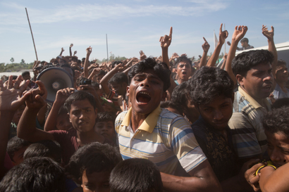 Rohingya refugees shout slogans during a protest against the repatriation process at Unchiprang refugee camp near Cox's Bazar, in Bangladesh, Thursday, Nov. 15, 2018. The head of Bangladesh's refugee commission said plans to begin a voluntary repatriation of Rohingya Muslim refugees to their native Myanmar on Thursday were scrapped after officials were unable to find anyone who wanted to return. (AP Photo/Dar Yasin)