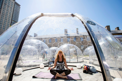 woman meditating on yoga mat inside bubble