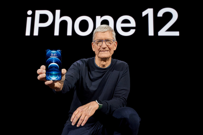 Apple CEO Tim Cook poses with the all-new iPhone 12 Pro at Apple Park in Cupertino, California, U.S. in a photo released October 13, 2020.