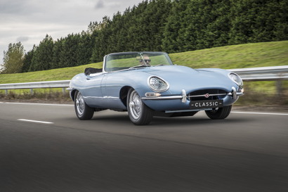 Jaguar E-type Zero being driven on the road.