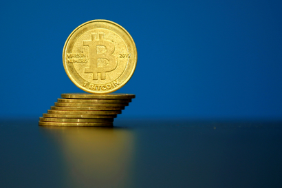 FILE PHOTO: Bitcoin (virtual currency) coins are seen in an illustration picture taken at La Maison du Bitcoin in Paris, France, May 27, 2015.