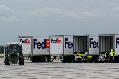 : FedEx trucks line up to receive pallets from a U.S. Air Force C-17 carrying 78,000 lbs of Nestlé Health Science Alfamino Infant and Alfamino Junior formula from Europe at Indianapolis Airport on May 22, 2022 in Indianapolis, Indiana. The mission, known as Operation Fly Formula, is being executed to address an infant formula shortage caused by the closure of the United States largest formula manufacturing plant due to safety and contamination issues.