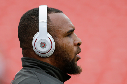 A football players wearing headphones.
