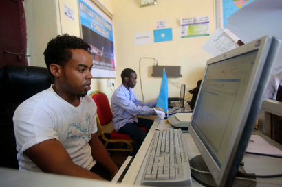 An internet cafe manager uses a computer in an internet cafe in the Hodan area of Mogadishu October 9, 2013.