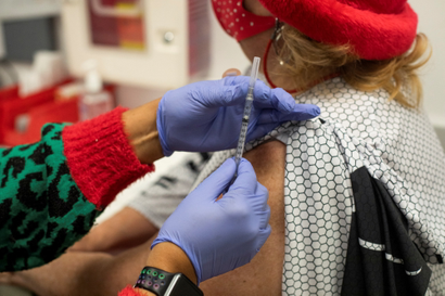A nurse prepares to administer a covid-19 vaccine.