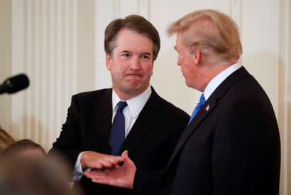 Supreme Court nominee Judge Brett Kavanaugh shakes hands with U.S. President Donald Trump in the East Room of the White House in Washington, U.S., July 9, 2018. REUTERS/Jim Bourg - RC149AFEBB30