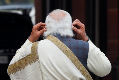 India's Prime Minister Narendra Modi, featured from the back.