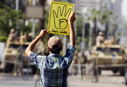 A supporter of ousted Egyptian President Mohamed Morsi protests against the military and interior ministry in Cairo.