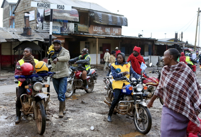 Motorbike riders, referred to locally as "boda boda" drivers, wait to transport people to the venue where Pope Francis is expected to lead a mass in the Kangemi slums on outskirts of the capital Nairobi, November 27, 2015.