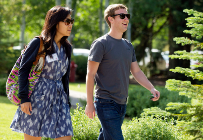 FILE - In this July 9, 2011 file photo, Facebook president and CEO Mark Zuckerberg, right, walks to morning sessions with Priscilla Chan during the Allen and Co. Sun Valley Conference, in Sun Valley, Idaho. Zuckerberg and his wife, Chan, are donating $25 million to the CDC Foundation to help address the Ebola epidemic, the foundation said Tuesday, Oct. 14, 2014. (AP Photo/Julie Jacobson, File)