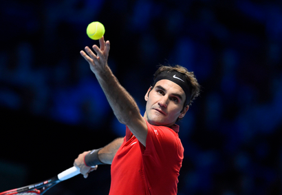 Roger Federer of Switzerland serves during his men's singles tennis match against Milos Raonic of Canada at the ATP World Tour Finals at the O2 Arena in London November 9, 2014. REUTERS/Dylan Martinez (BRITAIN - Tags: SPORT TENNIS) - RTR4DH9C