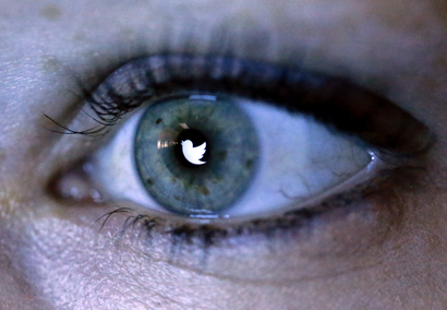 twitter logo in woman's eye
