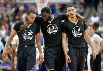 Golden State Warriors guard Stephen Curry (30), Draymond Green (23) and Klay Thompson (11) walk up court during the second half of an NBA basketball game against the Dallas Mavericks, Saturday, Dec. 13, 2014, in Dallas. Curry had 29-points, Green had 20-points and Thompson had 25-points in the 105-98 Warriors win. (AP Photo/Tony Gutierrez)