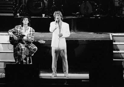 FILE - In this April 7, 1985 file photo, George Michael and Andrew Ridgeley of the British group WHAM! perform during a concert in Peking, China. Michael, who rocketed to stardom with WHAM! and went on to enjoy a long and celebrated solo career lined with controversies, has died, his publicist said Sunday, Dec. 25, 2016. He was 53. (AP Photo)