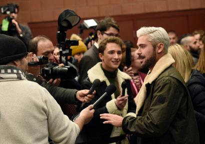 Zac Efron, right, who portrays serial killer Ted Bundy in "Extremely Wicked, Shockingly Evil and Vile," works the press line at the premiere of the film during the 2019 Sundance Film Festival, Saturday, Jan. 26, 2019, in Park City, Utah.