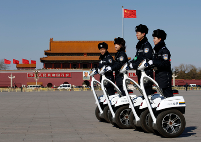 Police offices ride on motorized vehicles ahead of the opening session of Chinese People's Political Consultative Conference (CPPCC) at Tiananmen Square in Beijing, March 3, 2015. REUTERS/Kim Kyung-Hoon