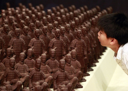 A boy looks at chocolate Terracotta Warriors displayed at the World Chocolate Wonderland in Taipei.