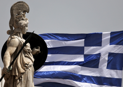 A Greek national flag flutters next to a statue of ancient Greek goddess Athena, in Athens May 21, 2015. Greek Finance Minister Yanis Varoufakis has raised a fresh furore by telling a newspaper that he taped a confidential meeting of euro zone finance ministers, drawing criticism that he was undermining Greece's efforts to secure aid from lenders.