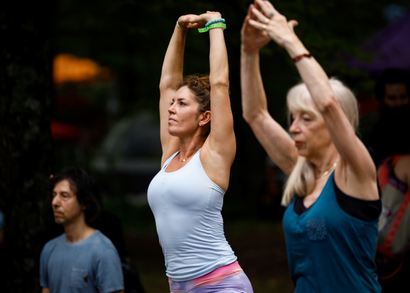Guests take part in morning yoga during the celebration of the 50th anniversary of the Woodstock Festival on Max Yasgur's original homestead in Bethel