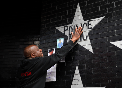 Donnie Straub of Minneapolis touches a star bearing Prince's name