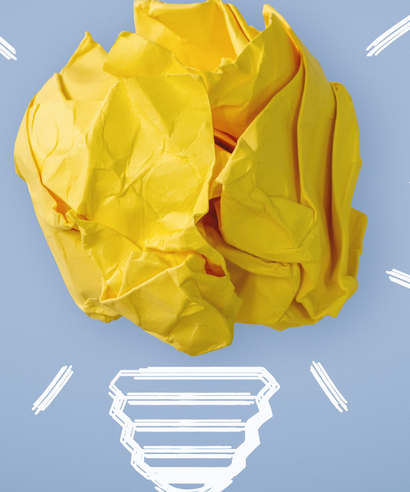 New Idea. Crumpled Paper Ball Glowing Bulb Concept.