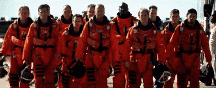 A scene from the 1998 film Armageddon, where astronauts are shown dramatically walking toward the camera.