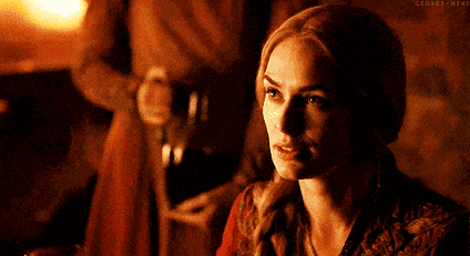 A animated gif of Cersei Lannister from the TV series Game of Thrones holding up a wine glass with the caption More wine.