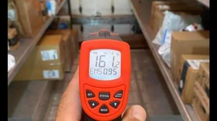 A temperature gauge is shown in a package delivery vehicle and it says 161 degrees F. 